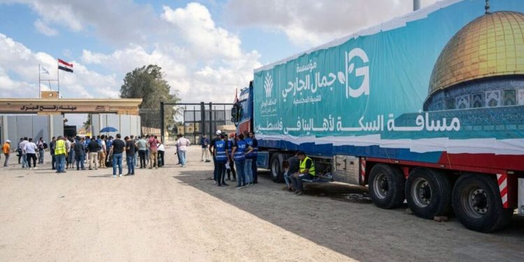 Egyptian ngo volunteers protest at rafah crossing demanding aid delivery