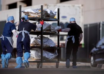 File photo: el paso county medical examiner's office staff move bodies in el paso