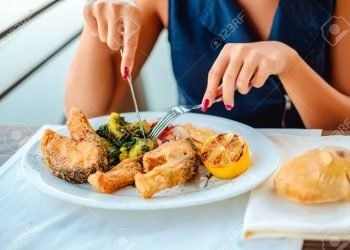 Girl eating lunch in the restaurant
