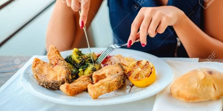 Girl eating lunch in the restaurant