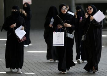 File photo: saudi students walk at the exhibition to guide job seekers at glowork women's career fair in riyadh